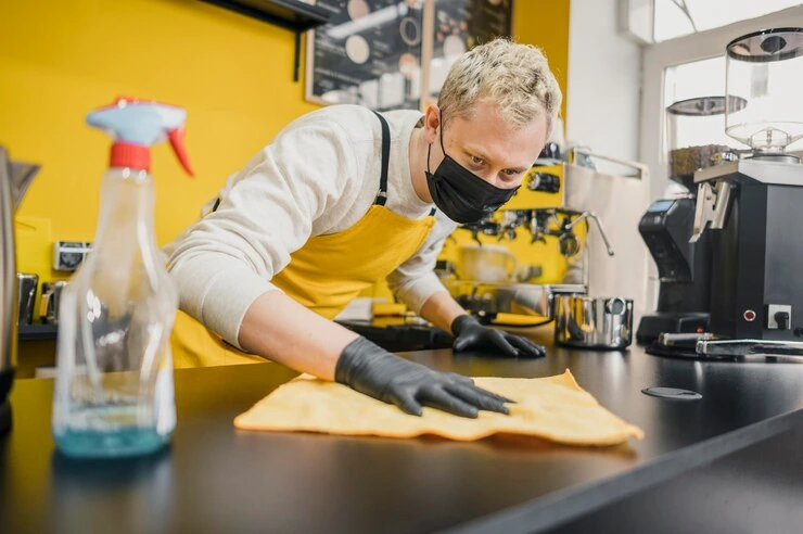 Expert cleaner cleaning cafe in London