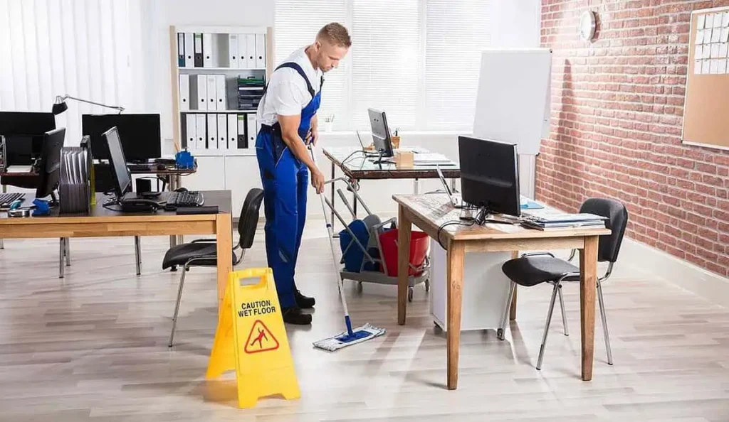 professional cleaning with caution wet floor sign in london